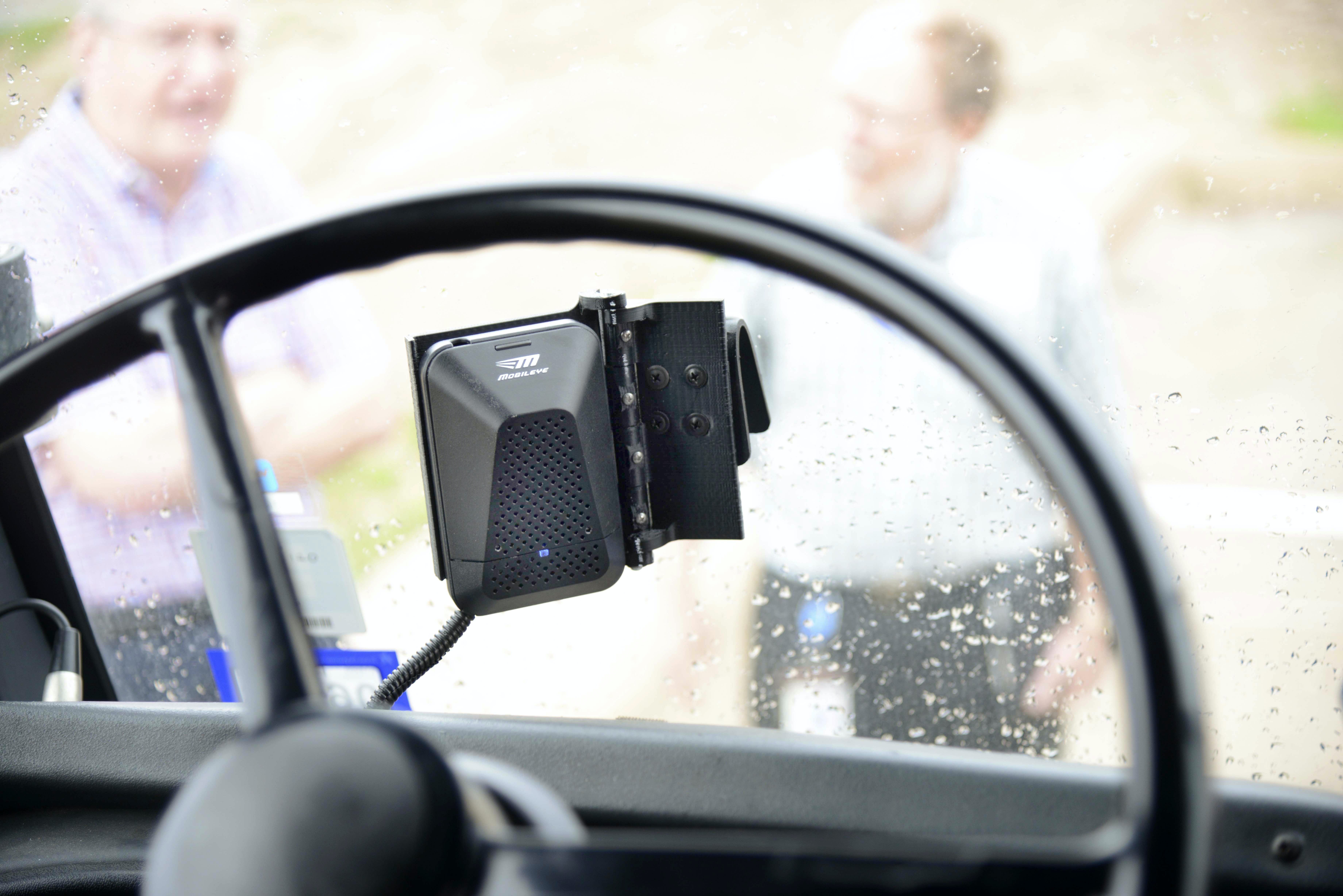 A pedestrian sensor mounted in the cab of a test vehicle.