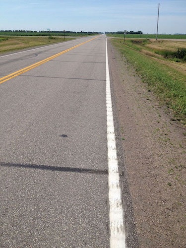 A hybrid rumble strip design includes a 6-in. pavement marking with 4 in. of painted grooving and an additional 2 in. of grooving outside the painted edge line.